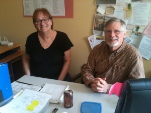 Counsellor Libbi Smith and computer volunteer Dennis Derfler take a break in the CCC's main office.